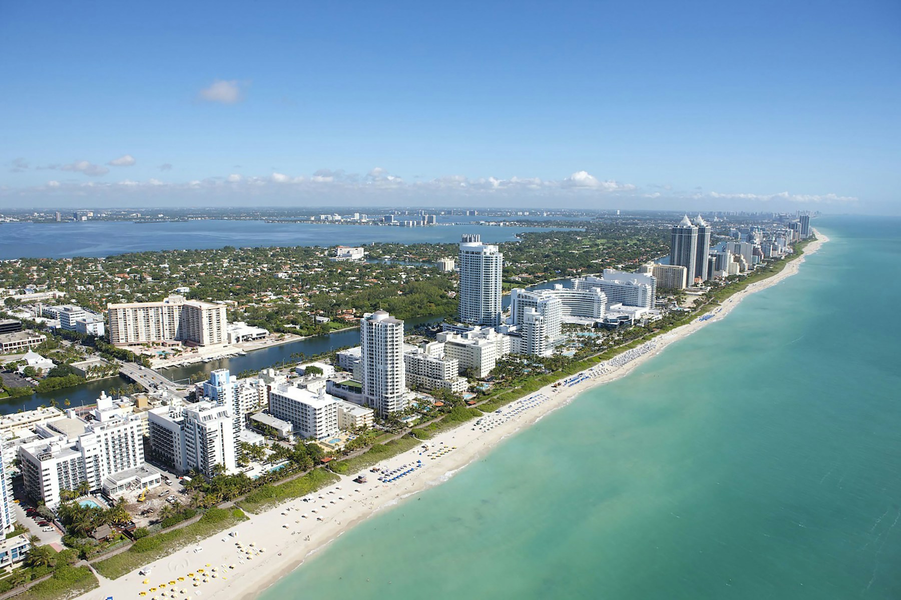 Aerial view of Miami Beach, Florida, with its coastline and turquoise Atlantic waters
